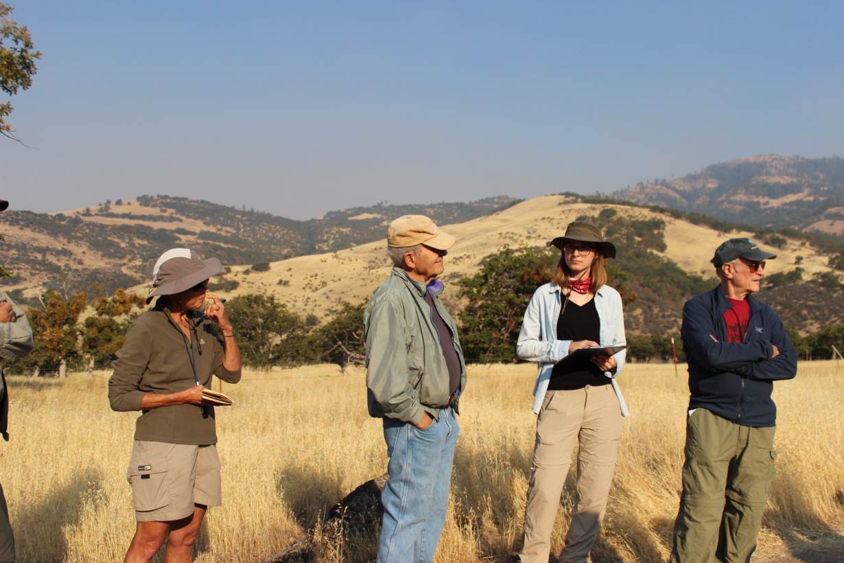 Residents of southern Oregon listen to a field lecture by a local geologist organized by the Friends of the Cascade-Siskiyou National Monument