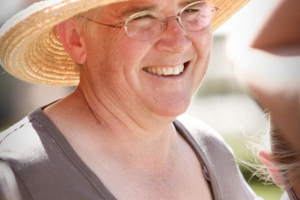 Dr. Lanita Witt wearing summer hat at event on the ranch