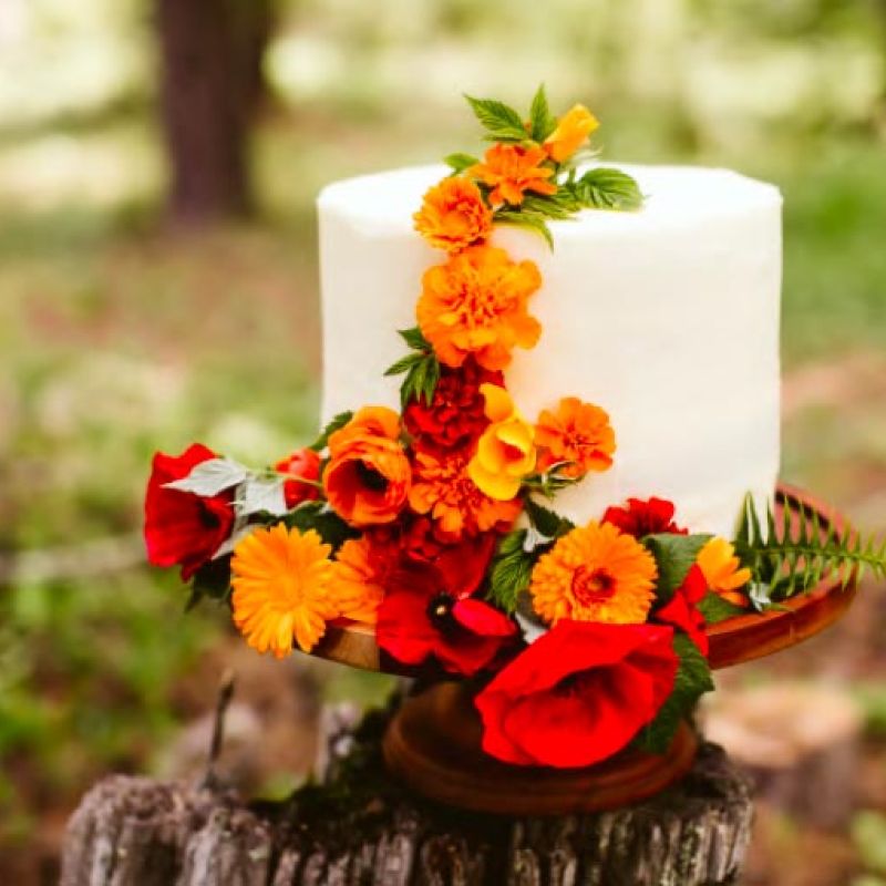 wedding cake decorated with flowers by Viva Flora, photo by Red Aspen Photography