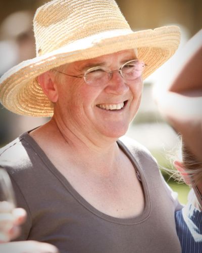 Dr. Lanita Witt wearing summer hat at event on the ranch