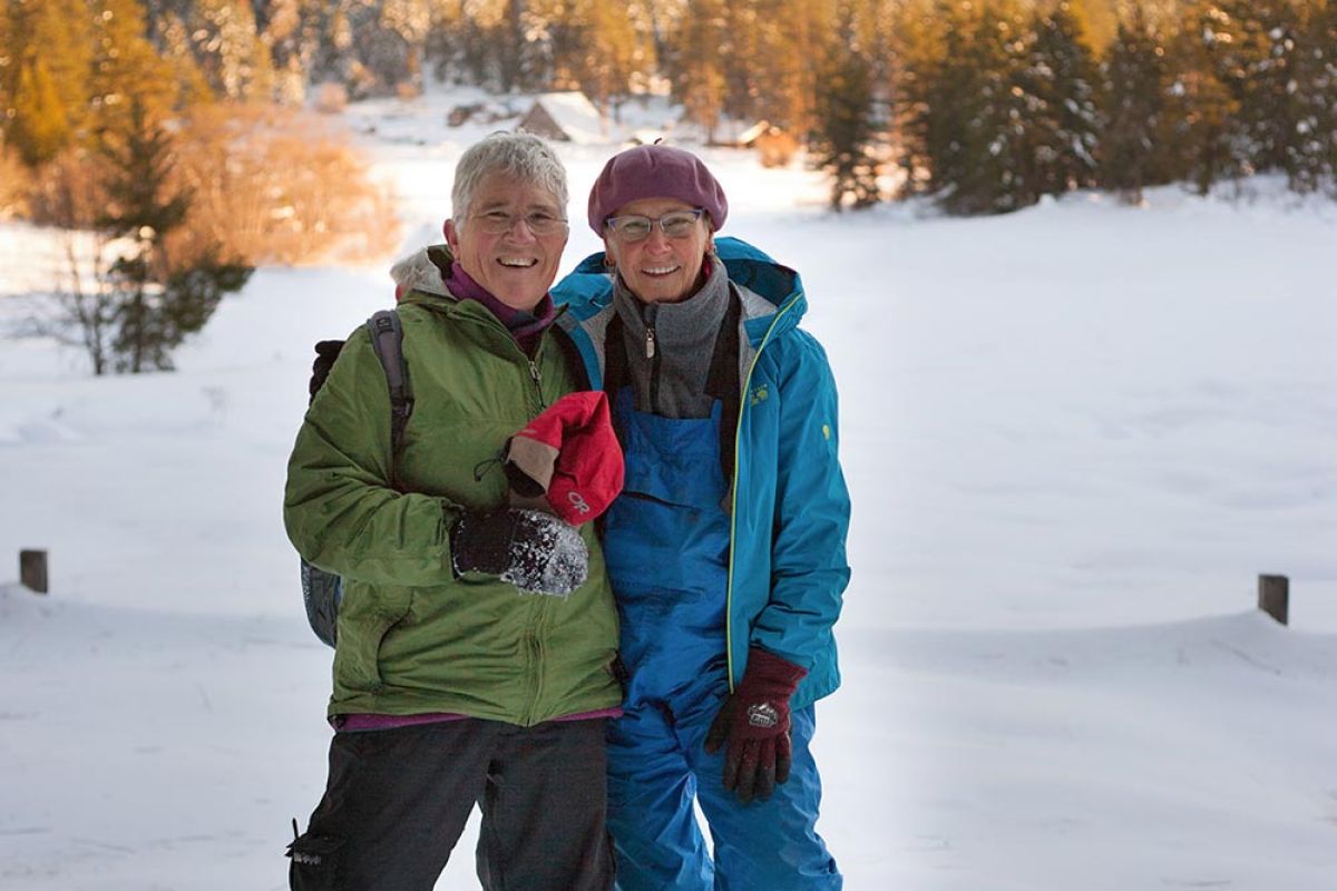 family building snowmen during winter farm stay at the Meadow House
