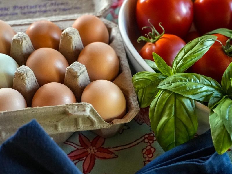Rainbow eggs, garden tomatoes and basil